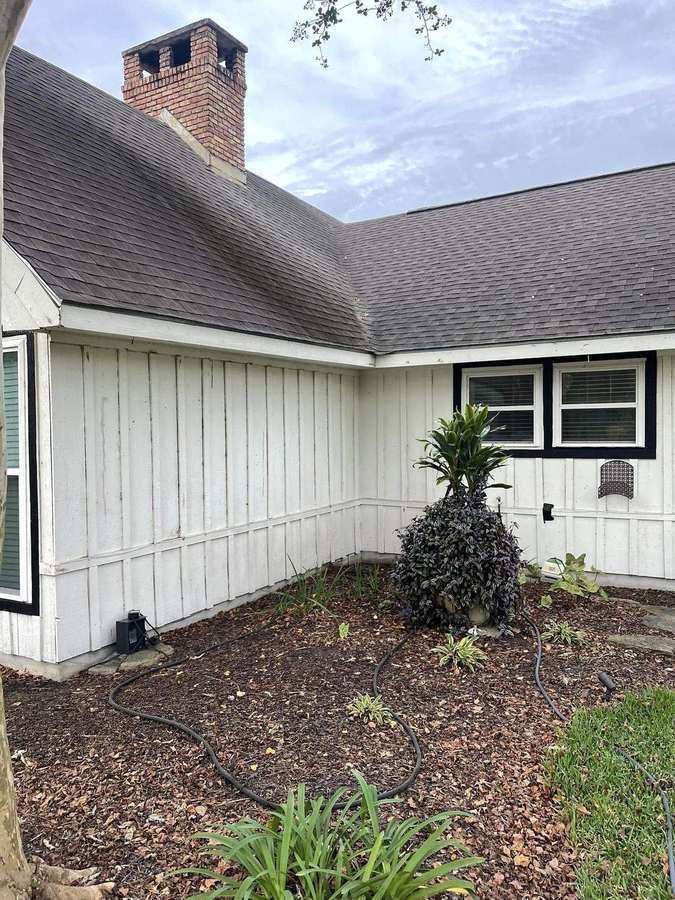 Two-story siding before and after house washing