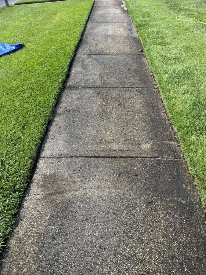 Concrete sidewalk before pressure washing